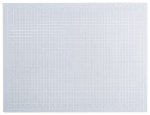 The Dahle Vantage® Premium Self-Healing Cutting Mat, 18 x 24, Crystal Clear (Case Of 12), features a durable surface with grid lines and measurements in inches and centimeters, perfect for precision cutting and crafting.