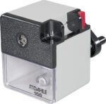 The Dahle 166 Premium Pencil Sharpener, with its sleek silver and black design, features a clear shavings compartment, hand crank, and unique red lever. The brand name and model number are clearly displayed to add quality and style to any workspace.