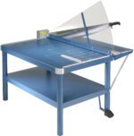 The Dahle 585 Large Format Premium Guillotine offers a blue design with a sturdy metal stand, 43 cut length, long handle, safety guard, adjustable guide for precise cutting, spacious working surface, and convenient foot pedal for easy operation.