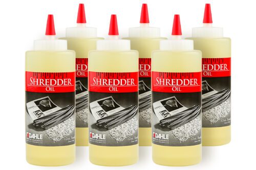 A case of Dahle 20721 Shredder Oil includes six 12-ounce bottles arranged in two rows, each with a red cap and a label featuring shredded paper and Shredder Oil prominently displayed.