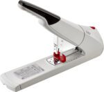 The Novus B56 Heavy Duty Stapler (Case Of 10) sports a sleek white and black design, an extended base for large stacks, and an ergonomic handle for comfort. A subtle red accent enhances its style by the loading area.