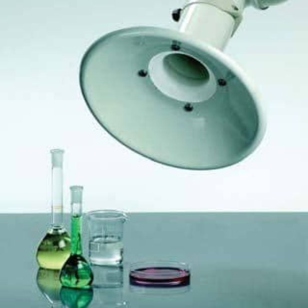 In a meticulous laboratory scene, under the round air vent, high-quality lab equipment showcases a green liquid in an Erlenmeyer flask and a yellow liquid nearby. Optimize your workspace with our premium fume hoods to enhance safety and efficiency amidst clear liquids and petri dishes.