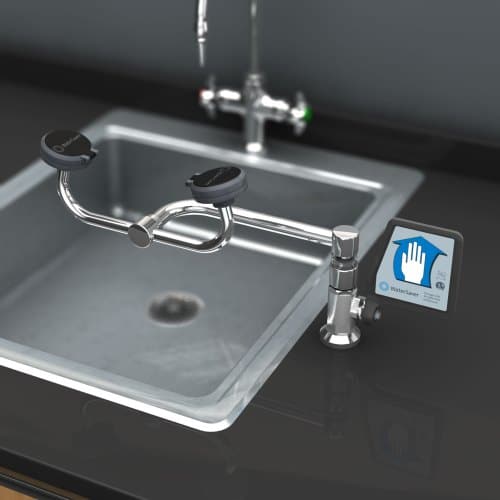 A stainless steel kitchen sink with a touchless faucet seamlessly blends modern design with innovation. The sleek faucet, featuring gesture control via a sensor pad, ensures convenience. This clean setup mirrors the precision found in customizable fume hoods designed for laboratory safety solutions.