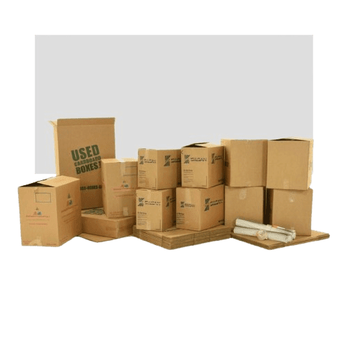 A collection of various-sized cardboard boxes, some open and some closed, are stacked together. A few flattened boxes and two rolls of packing paper are placed in front. The largest box reads Used Cardboard Boxes.