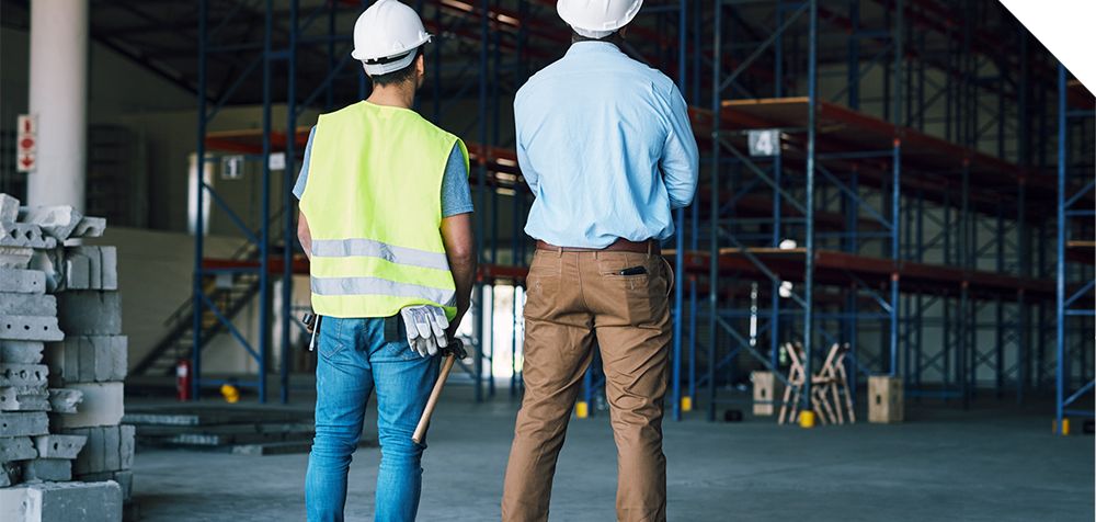 two men in a warehouse