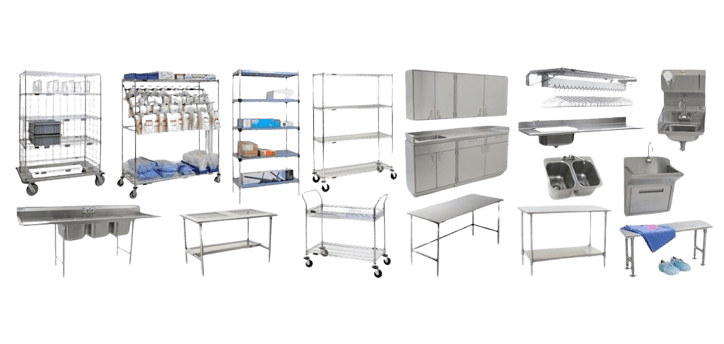 A collection of silver kitchen equipment, including shelves, trolleys, sinks, and storage units crafted from stainless steel. Some items have wheels for mobility. The setup is arranged in a spacious layout, suggesting a professional or industrial kitchen environment akin to laboratory equipment.