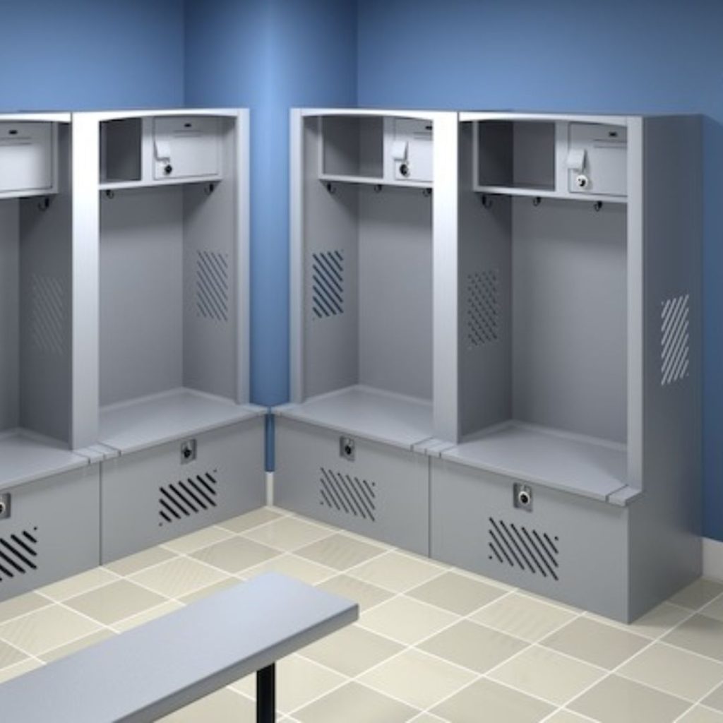 A clean, empty locker room in the law enforcement department features three gray metal lockers against a blue wall. Each locker includes a shelf, hooks, and a lockable compartment at the bottom. The light-colored tiled floor complements the small bench placed in front of the lockers.