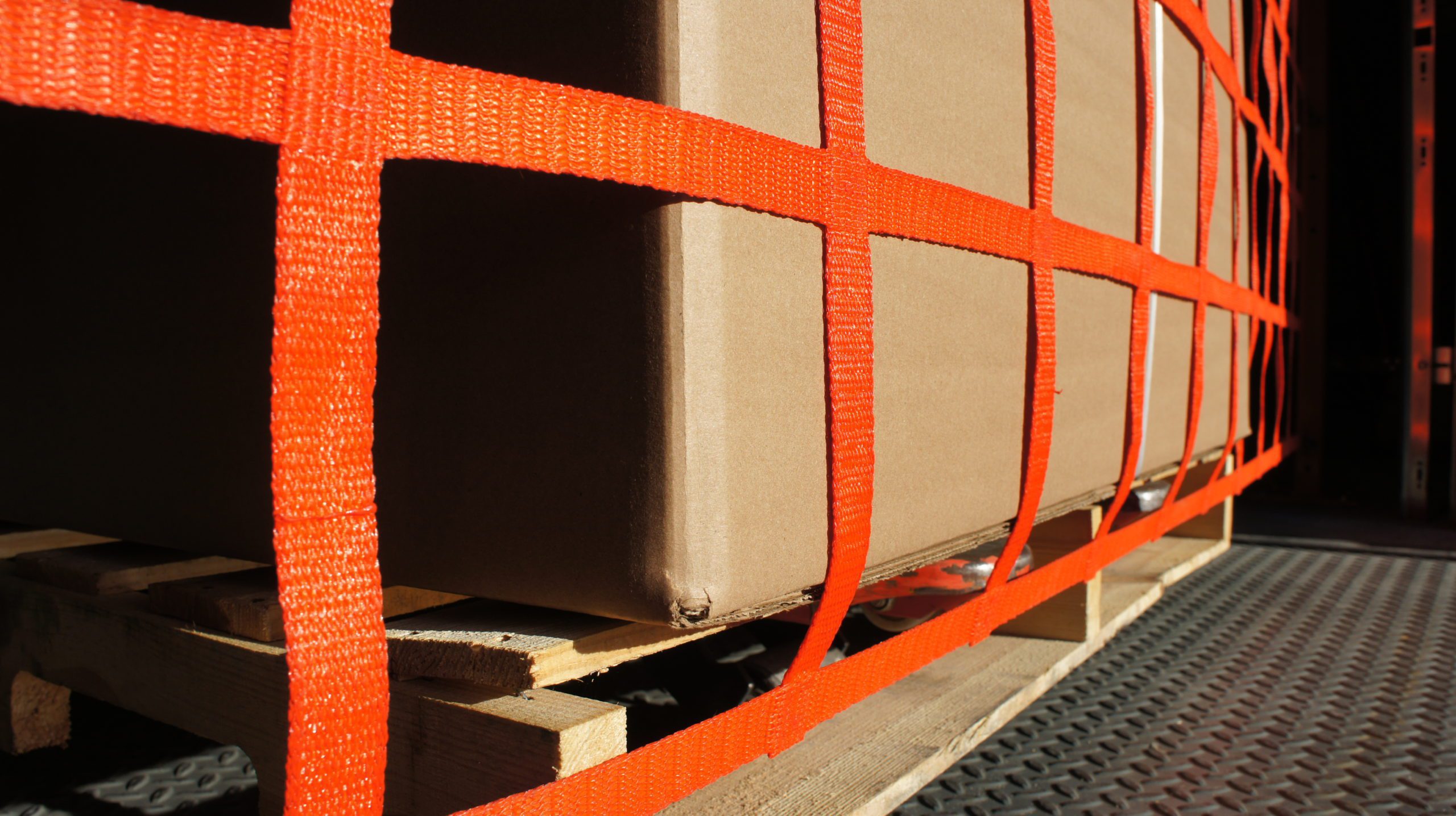 Detail of orange webbing at a dock barrier