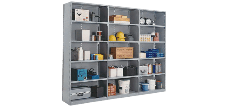 A large gray Penco metal shelving unit brims with various items. The shelves host boxes, yellow helmets, stacked books, paint cans, cleaning supplies, small appliances, and other miscellaneous objects, capturing a vivid image of organized chaos.
