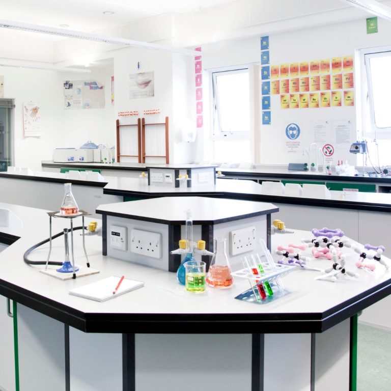 Teaching laboratory with a hexagonal island bench, service turrets and stools