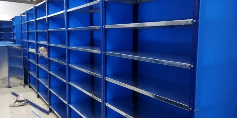Parts warehouse aisle with automated parts storage between tall shelving runs