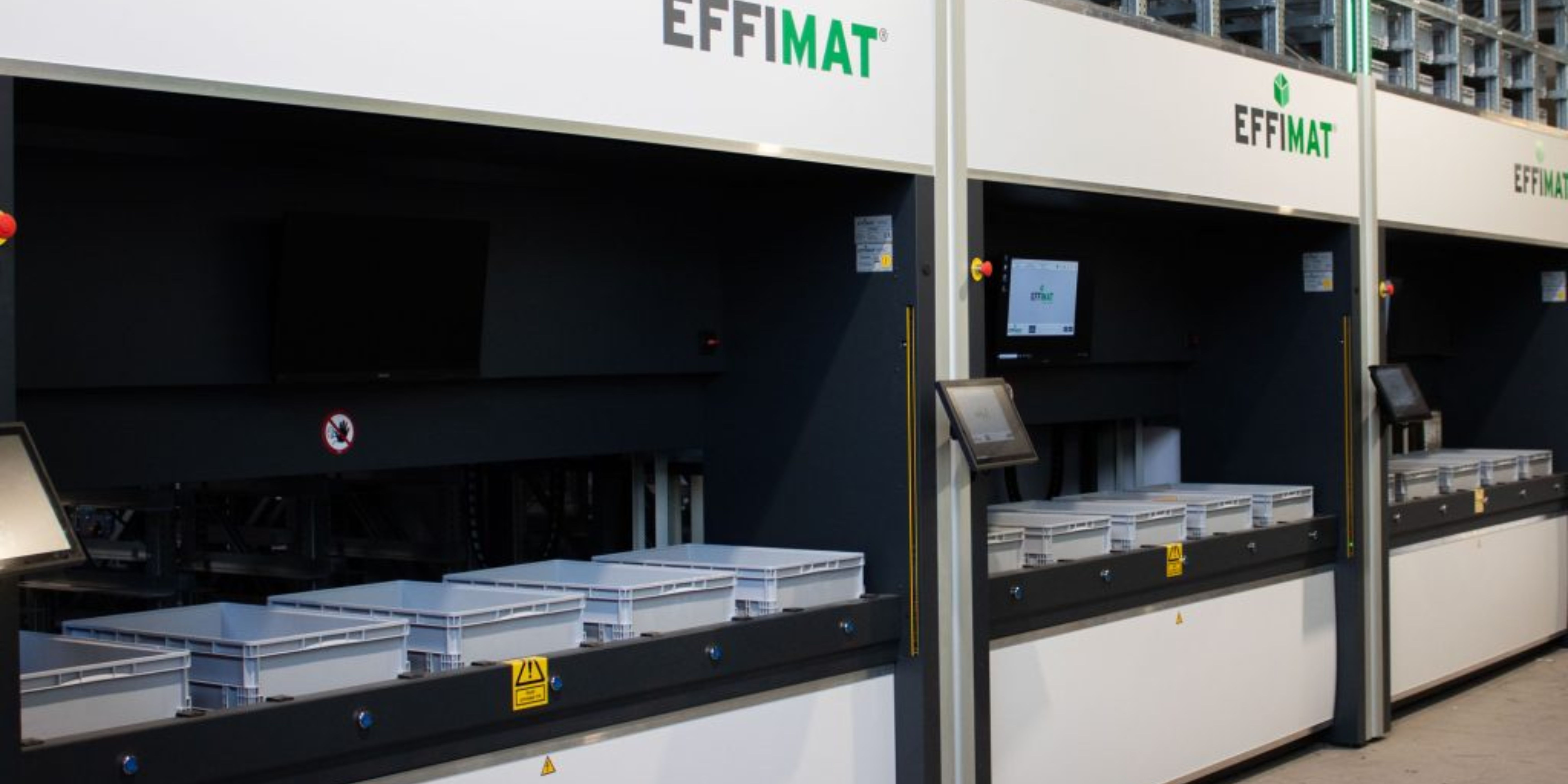 EffiMat automated box storage and goods-to-person picking tower in a distribution center
