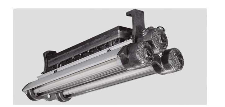 A streetlight fixture with three cylindrical metal components, mounted on a flat base, embodies industrial design with visible bolts and a metallic finish. Perfect for lab settings, its explosion-proof LED lights ensure safety against hazardous conditions. Set against a plain, light grey background.