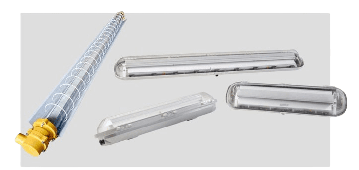 Four UL-certified explosion-proof fixtures are displayed: one tube-shaped with a yellow cap and protective grid, and three rectangular with gray casings and transparent covers, set against a gray background. Perfect as lab explosion-proof LED lights, these pieces ensure safety and clarity.