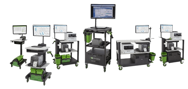 Introducing a line of industrial mobile workstations equipped with monitors, keyboards, and shelves. Each unit boasts green accents and wheels for mobility, featuring various configurations of electronic devices and storage compartments, perfect for exploring Newcastle Systems brochures.
