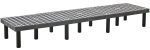 The Quantum Polymer Dunnage Rack, made in the USA, is a long rectangular polyethylene bench with a vented surface and multiple black cylindrical legs, featuring an impressive 1400 lb. load capacity.