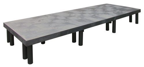 A modern gray Quantum Polymer Dunnage Rack with a textured polyethylene surface and sturdy black legs, made in the USA, supports up to 2700 lbs. Ideal for large meetings or dining spaces.
