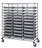 The Quantum Bin Cart is a mobile, triple-bay rack measuring 24W x 60L x 69H with a chrome-plated finish. It includes thirty-three gray bins (22.5L x 17.5W x 3H each) and features four caster wheels for easy movement, making it an ideal storage solution with its sleek, industrial design.