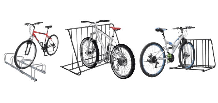 Three bicycles parked in metal bike racks—freeing up balcony space. The first bike is red, the middle one silver, and the third white with green accents. The racks vary in design: the first metallic, while the others are painted black. Get bikes off your balcony today!.