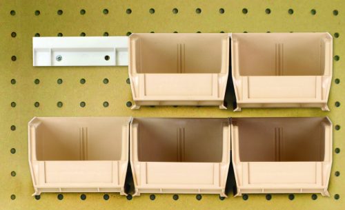 Six ivory Quantum Hang-N-Stack Bins (Qus220) with dimensions 7-3/8L x 4-1/8W x 3H, along with two bin rails, are mounted on a pegboard wall in two rows—three on top and three below—efficiently utilizing the pegged wall space for an organized look.
