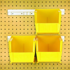 The package includes four yellow Quantum Hang-N-Stack Bins (10-7/8L x 5-1/2W x 5H) and two white mounting rails; they are arranged on a beige perforated pegboard with evenly spaced holes for easy organization.