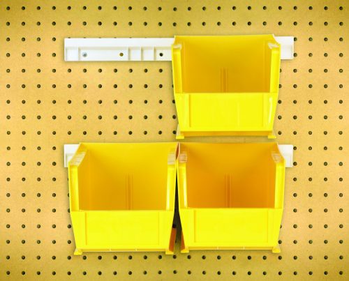 The package includes four yellow Quantum Hang-N-Stack Bins (10-7/8L x 5-1/2W x 5H) and two white mounting rails; they are arranged on a beige perforated pegboard with evenly spaced holes for easy organization.