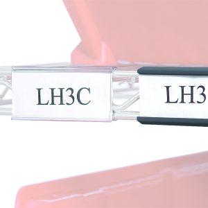 A close-up image features two clear 3 Quantum Label Holders. The first holder displays LH3C, and the second shows LH3B, set against a red container backdrop.