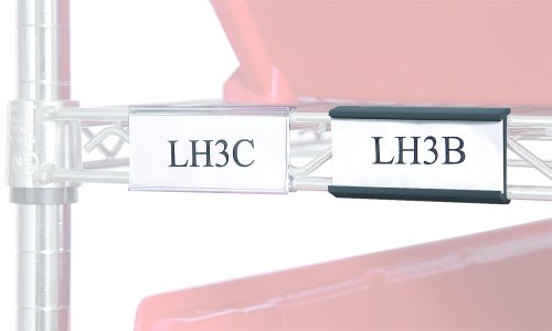 A close-up image features two clear 3 Quantum Label Holders. The first holder displays LH3C, and the second shows LH3B, set against a red container backdrop.