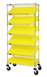 The Quantum Bin Systems Unit is a 36L x 18W x 80H mobile metal rack with a chrome finish, featuring (5) slanted and (2) flat wire shelves. It includes (4) posts, (48) yellow bins (QSB103), and rolls on (4) 5 swivel polyurethane casters for easy movement. Suitable for dry storage applications.
