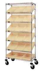 The Quantum Bin Systems Unit, 36L x 18W x 80H, features a chrome finish and is suitable for dry storage. It includes four posts, two flat wire shelves, five slanted wire shelves with dividers, and eighteen ivory bins. The unit is mobile with four 5 swivel polyurethane casters (two with brakes).