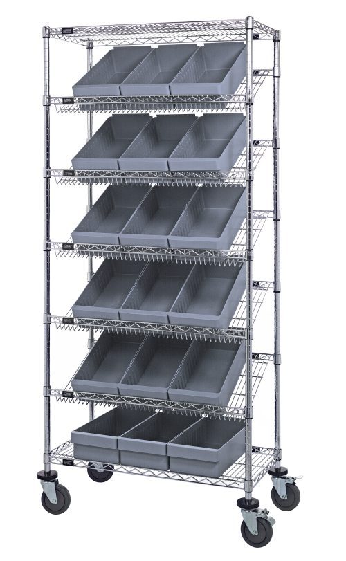 The Quantum Bin Systems Unit is a mobile shelving unit measuring 36L x 18W x 80H. It includes four posts, two flat wire shelves, five slanted wire shelves, and eighteen gray bins. Featuring a sleek industrial chrome-plated finish and four swivel casters, its perfect for dry storage.