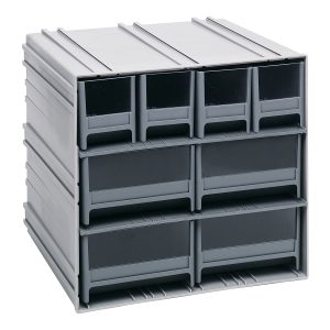 The Quantum Interlocking Storage Cabinets feature gray drawers made in the USA, measuring 11-3/8D x 11-3/4W x 11H. Each includes two dividers and can interlock horizontally or vertically. They have windows and a ridged surface, perfect for seamless organization alongside windows.
