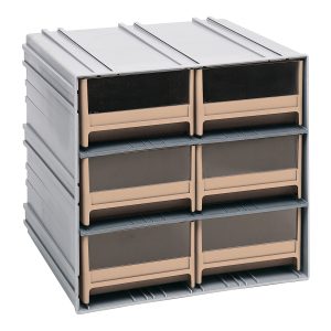 The Quantum Interlocking Storage Cabinet, measuring 11-3/8D x 11-3/4W x 11H, features six ivory drawers and brown-tinted windows for easy viewing. It assembles in two columns of three rows and interlocks horizontally or vertically, offering a gray plastic exterior to organize essentials. Made in the USA.