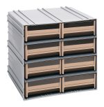 The Quantum Interlocking Storage Cabinet measures 11-3/8D x 11-3/4W x 11H and features eight ivory sliding drawers with windows and two dividers each, arranged in two columns and four rows. This gray, stackable unit offers flexible storage, interlocking vertically or horizontally. Made in the USA.