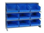 The Quantum Pick Rack, in a bench style with dimensions of 12-1/2L x 36W x 26-1/2H and a capacity of 250 lbs., features three shelves holding nine Qsb209 blue bins. This sloped arrangement allows easy access against a plain white background.