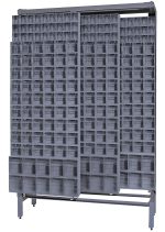 The large industrial storage unit, made of tough 14-gauge steel, features sliding panels and a sturdy metal frame. It includes (8) QTB305, (36) QTB306, and (12) QTB309 tip-out gray bins organized in rows on shelves. Dimensions: 18D x 48W x 77H with a load capacity of 2000 lbs.