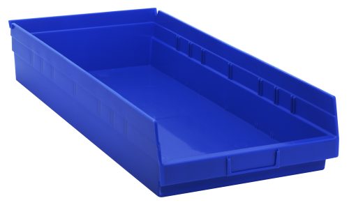 A blue polypropylene Economy Shelf Bin, 23-5/8W x 11-1/8D x 4H, with a molded-in label holder and rear hanglock, includes seven divider slots. The empty bin rests on a white background. Made in the USA.