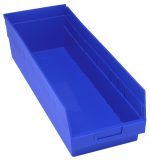 The Quantum Economy Shelf Bin is a large, blue, rectangular polypropylene storage bin with dimensions of 23-5/8W x 8-3/8D x 6H. It features an open top, molded-in label holder, nesting design, rear hanglock, and a glossy finish. Made in the USA.