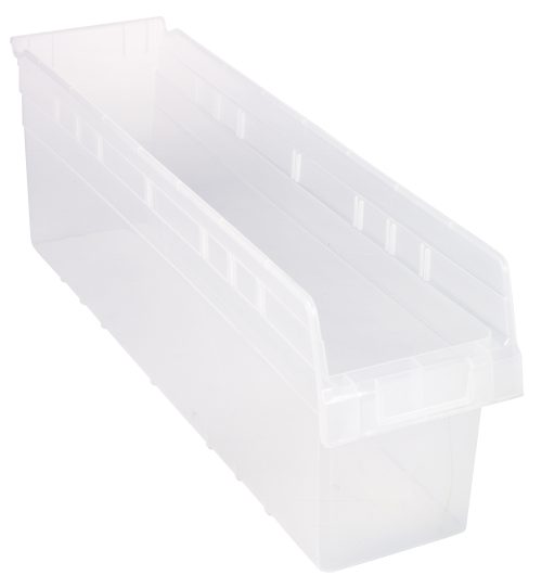 The Quantum Economy Shelf Bin, made of clear polypropylene and measuring 23-5/8W x 6-5/8D x 4H, features a rectangular shape with an open top. It includes a rear hanglock and seven divider slots for organization. The bin is empty against a white backdrop. Made in the USA.