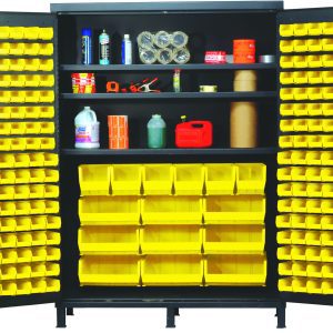 The Quantum Heavy-Duty 60 Bin Cabinet, measuring 60W x 24D x 84H and featuring a 500 lb. capacity per shelf with all-welded, gray powder-coated construction, is open to reveal its durable design filled with yellow QUS210 bins and various supplies on the top shelf.
