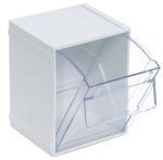 The Quantum Tip Out Bin, a clear plastic container with a polystyrene white cabinet, features one compartment with an angled lid that opens to 45° for easy viewing and access. Its dimensions are 5-1/4W x 4-3/4D x 6-1/4H, and it includes a handle with a label slot. Made in USA.