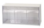 The Quantum Dividable Tip Out Bin features two compartments and a clear plastic container with a white polystyrene cabinet. It measures 23-5/8W x 5-1/4D x 5-15/16H, opens to a 45° angle, and includes a handle with a label slot for efficiently organizing small items. Made in the USA.