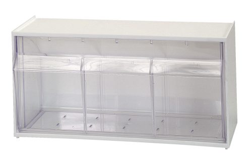 The Quantum Dividable Tip Out Bin features two compartments and a clear plastic container with a white polystyrene cabinet. It measures 23-5/8W x 5-1/4D x 5-15/16H, opens to a 45° angle, and includes a handle with a label slot for efficiently organizing small items. Made in the USA.