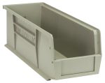 A stone-colored polypropylene Quantum Bin, 5-1/2W x 14-3/4D x 5H, features front, back, and side grips, a textured surface with Quantum embossed on the side. Includes anti-slide lock and molded-in label holder. Empty bin, angle view highlights depth.