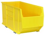 A large, bright yellow Quantum Hulk 36 Container with an open front and ribbed sides for reinforcement. This mobile bin, measuring 35-7/8L x 16-1/2W x 20-1/2H, features small wheels for easy maneuvering and is made in the USA from polypropylene.