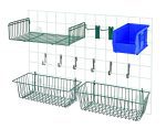The white grid wall organizer includes two green wire baskets, each 17L x 7W x 5H, and features Store Grid Accessory Pack 1 with various hooks, including (2) 6 hooks for neat hanging. The medium basket is situated at the top left.