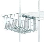The Quantum Utility Basket, measuring 11-1/4W x 18-7/8D x 7-5/8H with a chrome-plated finish, is attached to a metal shelving unit. This rectangular basket is mounted on the side and stands out against the solid white background, showcasing its sleek design.