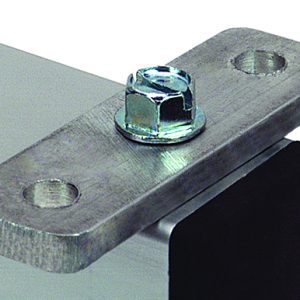 Close-up of an aluminum plate from the Quantum Wing Kit, affixed at a corner with a bolt and nut. The plate, metallic and polished, has two holes—one with the bolt and one empty.