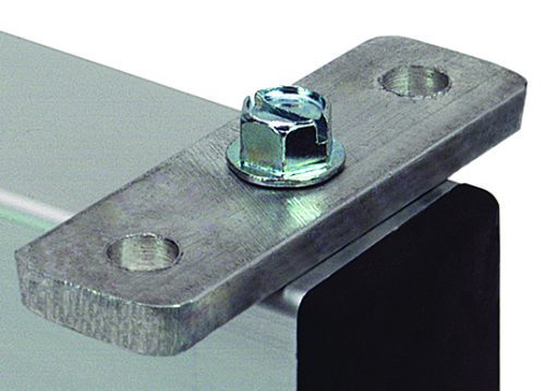 Close-up of an aluminum plate from the Quantum Wing Kit, affixed at a corner with a bolt and nut. The plate, metallic and polished, has two holes—one with the bolt and one empty.