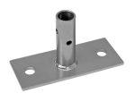 The Quantum Single Seismic Foot Plate is a rectangular metal bracket with a center-welded cylindrical tube. It includes two mounting holes on opposite sides and smaller holes in the tube for fastening or connecting.